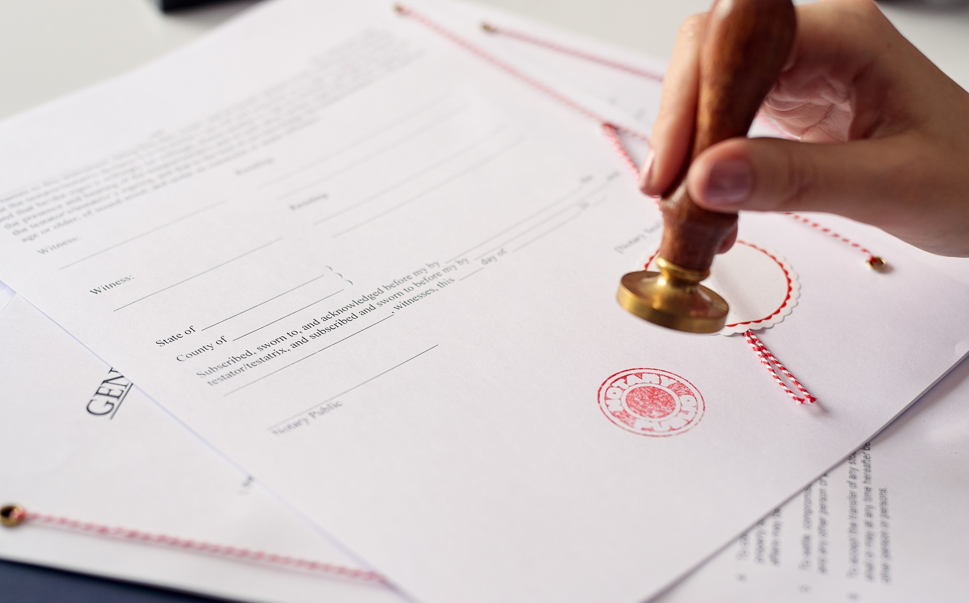 Close up on woman's notary public hand  stamping the document